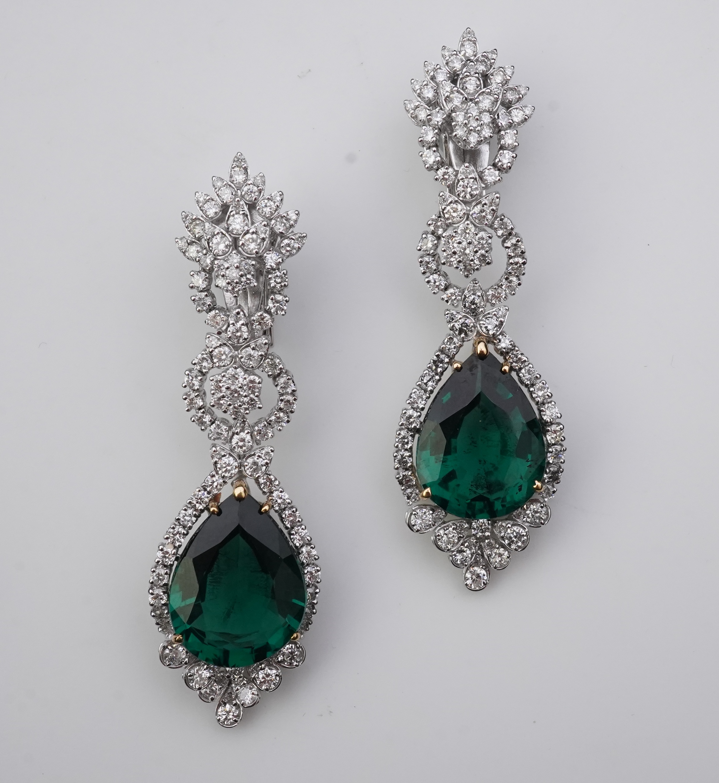 A pair of synthetic green quartz and diamond earrings